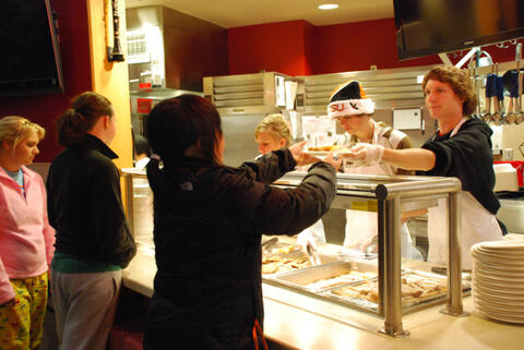 People at a food counter